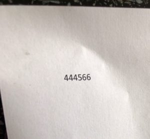 A piece of paper with  the number 444566 printed on it